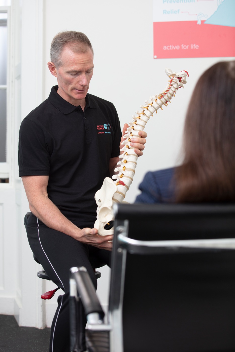Osteopath Gavin Routledge explaining spine