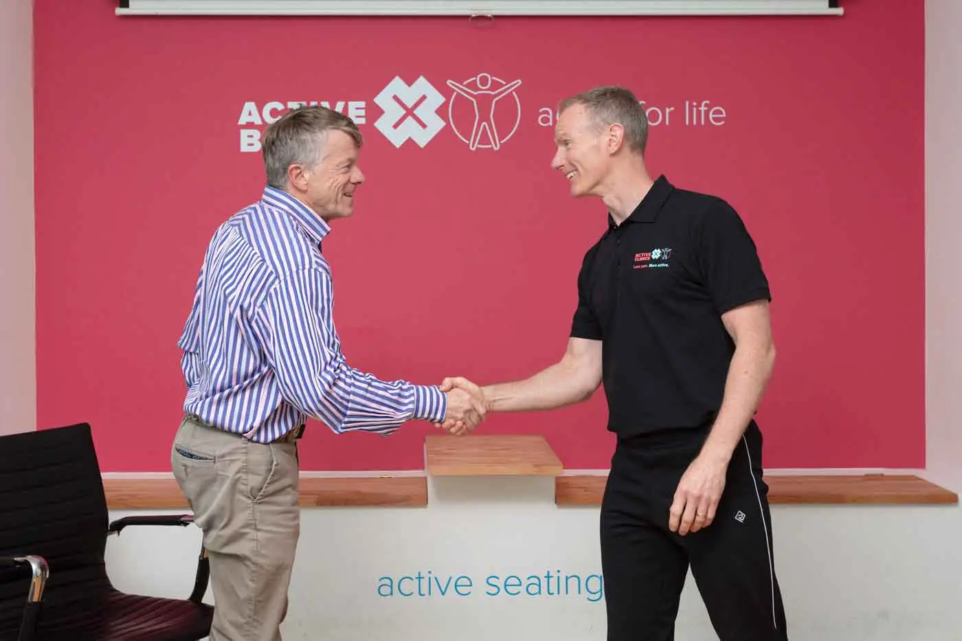 Osteopath Gavin Routledge meeting male client min