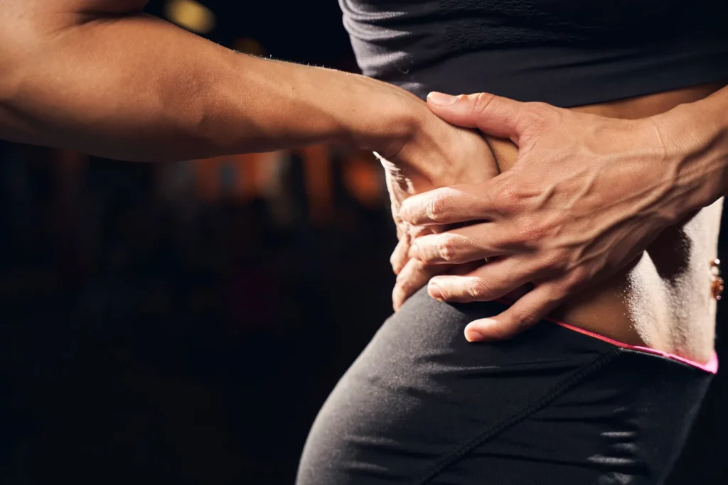 sportswoman being troubled by back muscle soreness 2023 11 27 05 36 22 utc